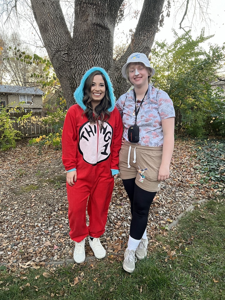Natalie, in a Thing 1 onesie, and Holly, dressed as a Tacky Tourist