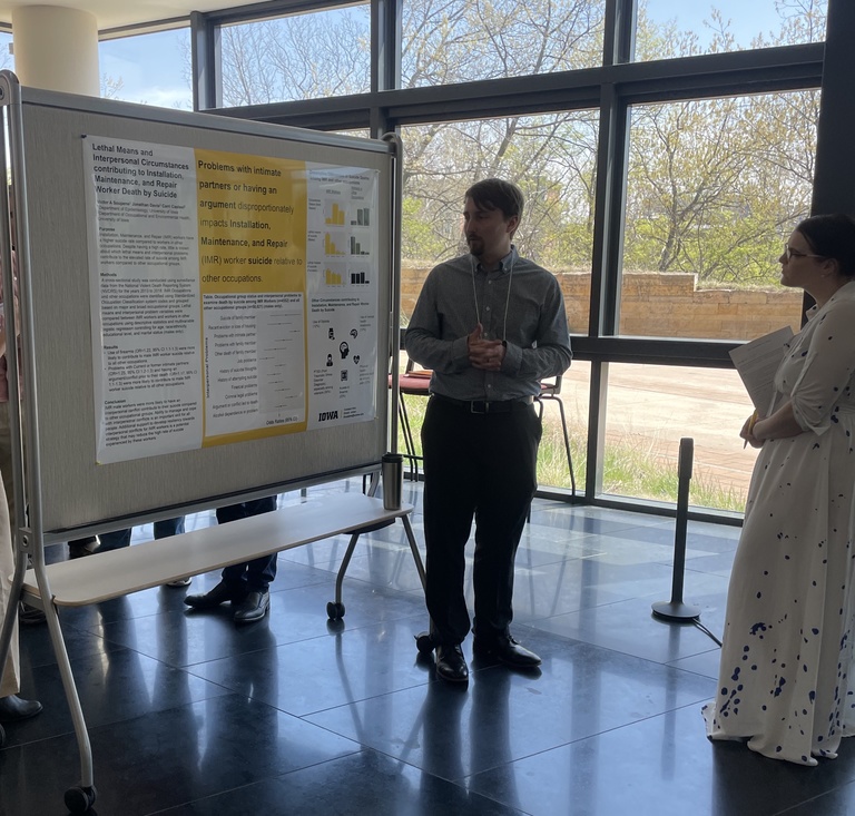 student presenting poster